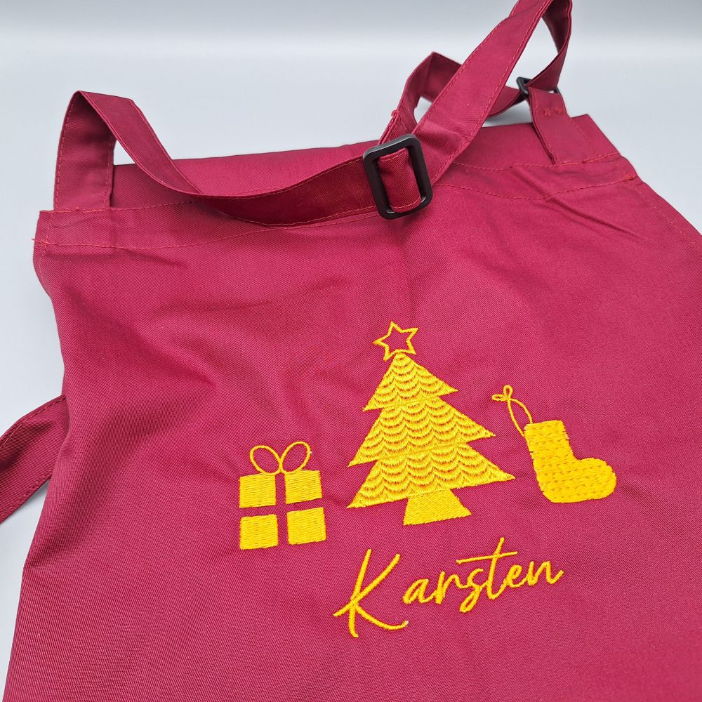 Latzschürzen mit dekorativem Stick